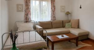 a living room with a couch and a table at Sunset Vista Apartment B in Mação