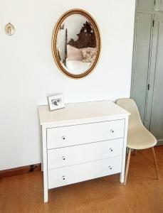 a white dresser in a room with a mirror at Sunset Vista Apartment B in Mação