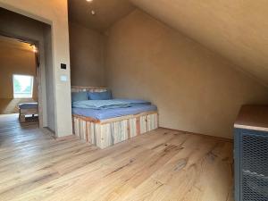 a bedroom with a bed in the corner of a room at Brühlbach-Blick in Morbach