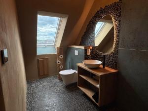 a bathroom with a sink and a mirror at Brühlbach-Blick in Morbach