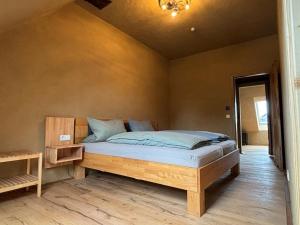 a bedroom with a bed in a room at Brühlbach-Blick in Morbach