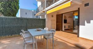 a blue table and chairs on a patio at Penyagolosa in Calella de Palafrugell