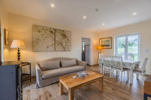 a living room with a couch and a table at 199 - Quinta dos Carvalhos in Castelo Branco