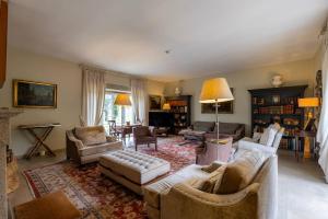 a living room with couches and chairs and a table at 199 - Quinta dos Carvalhos in Castelo Branco