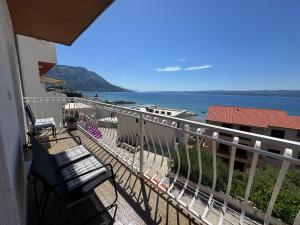 a balcony with a view of the ocean at Apartment Marino 2 in Duće