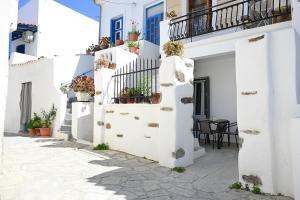 a street in positano with white buildings at MarGo House Kythnos in Kithnos