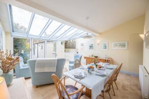 a dining room with a table and chairs at The Light House, Southwold in Southwold