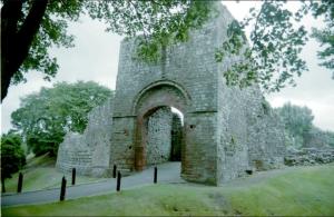 an old stone building with an arch in a park at Egremont Hide Away - Perfect contractor accommodation - Close to Sellafield in Woodend