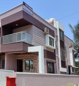 a building with a sign on top of it at Stay Origin, In Nashik in Nashik