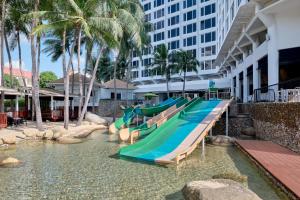 a group of slides in the water at a resort at Hard Rock Hotel Pattaya in Pattaya