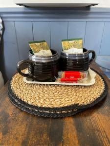 a tray with a stack of cups on a table at Shepherds Rest by the Wye in Fawley Station