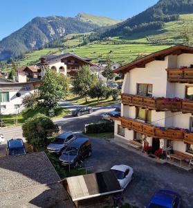 an aerial view of a town with cars parked outside a building at die Harmonie in Nauders