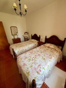 a bedroom with two beds and a mirror at CASA DA VILA 2, Sintra in Sintra