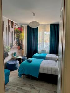 a bedroom with two beds and a living room at Sarajevo, Stari Grad, Apartment in Sarajevo