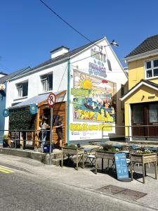 a building with a sign on the side of it at Sioscadh na Mara in Spiddal