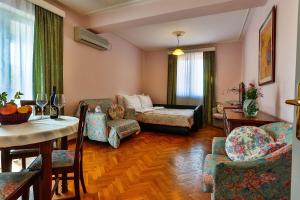 a living room with a couch and a table at Villa Velzon Guesthouse in Budva +54 photos