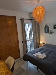 a bedroom with a bed and a large window at Vincents Paradise in Mairena del Aljarafe +24 photos