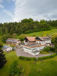 an aerial view of a large house in a field at Naturhotel Wieserhof in Longostagno