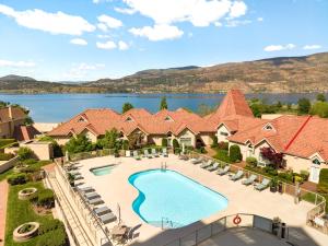 an aerial view of a house with a swimming pool at sunset 101 in Kelowna