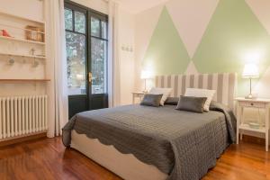 Ein Bett oder Betten in einem Zimmer der Unterkunft Suite Home Milano Fiera