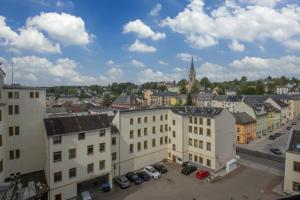a view of a city with buildings and cars at Hotel Lengenfelder Hof in Lengenfeld