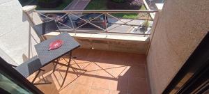 an overhead view of a table and chair on a balcony at Calle Maceiras, 1 - 1B in Combarro +7 photos