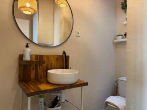 a bathroom with a sink and a mirror at Piso Bonaire in Sitges +17 photos