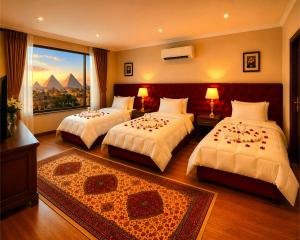 a hotel room with two beds and a window at MiRAGE PYRAMiDS HOTEL in Cairo +165 photos