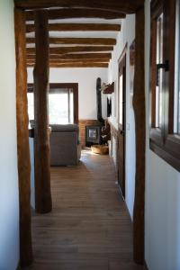 a hallway in a house with wooden beams at Alpujarra Las Lindes in Pórtugos