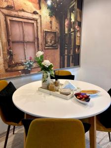 a white table with a tray of food on it at Sarajevo, Stari Grad, Apartment in Sarajevo