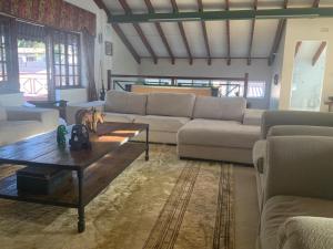 a living room with a couch and a coffee table at Executive Serviced Home in Johannesburg