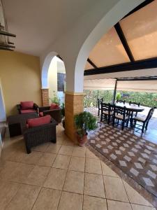 a living room with a patio with a table and chairs at Appartement MARINA AP4 SAIDIA in Saïdia