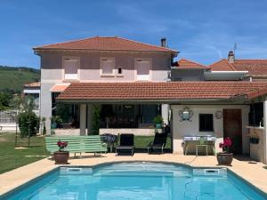 a house with a swimming pool in front of a house at Escapade Vallée du Doux in Tournon-sur-Rhône