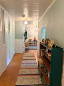 a hallway with a rug on the floor of a room at Kunnarainen in Sudsaloö