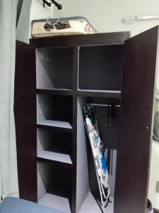 a shelf in a room with a snowboard at Sunflower Acres in Kimberley