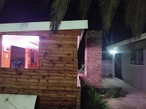a wooden facade of a house at night at Sunflower Acres in Kimberley