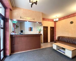 a hotel lobby with a reception desk and a waiting room at Vila Predeal Holidays in Predeal