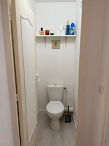 a bathroom with a white toilet in a room at Les 3 Pigeons in Narbonne +27 photos