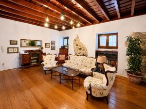 a living room with two couches and a table at Casa Luna - Agüimes in Agüimes