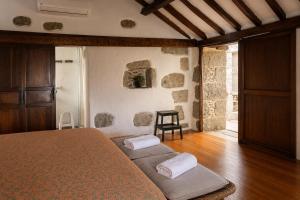 a bedroom with a bed with two pillows on it at Casa Luna - Agüimes in Agüimes
