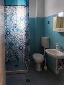 a bathroom with a toilet and a sink at Irini rooms Olympiada in Olympiada