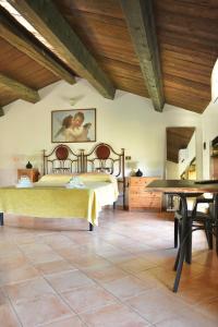 a bedroom with a bed and a wooden ceiling at Azienda Agrituristica Le Puzelle in Santa Severina
