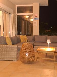 a living room with a couch and a table at Casa Eleonora lifestyle Lodge in Lagos