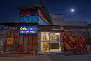 a store front with a sign in the window at FabHotel Shree Ram Aadhar 900 Mtr from Ram mandir in Ayodhya