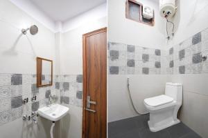 a bathroom with a toilet and a sink at Super Townhouse Krishna Nagar Metro Station in New Delhi