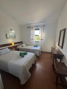 a hotel room with two beds and a window at Los Porches K28 in Playa del Ingles +21 photos