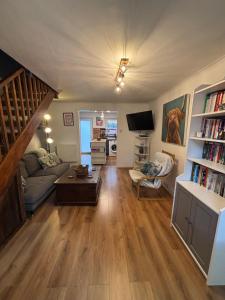 a living room with a couch and a table at Cosy home in Edinburgh in Edinburgh
