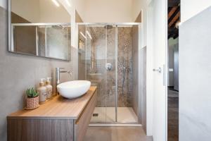 a bathroom with a sink and a shower at Tenuta dell'Oca Satolla in Pergine Valdarno +40 photos