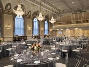 a banquet hall with tables and chairs and chandeliers at Fairmont Le Chateau Frontenac in Quebec City +256 photos