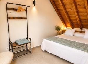 a bedroom with a bunk bed and a chair at La casa Suiza in Cercedilla